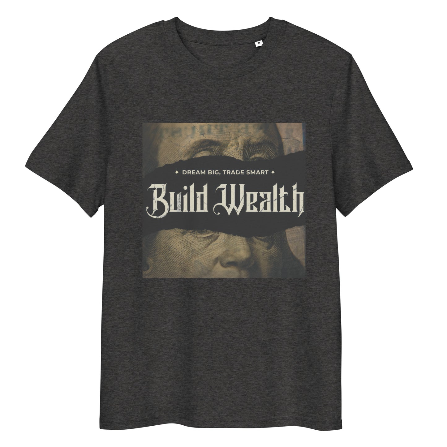 Man wearing dark gray t-shirt with vintage-style “Build Wealth” graphic and the phrase “Dream Big, Trade Smart,” styled with white pants