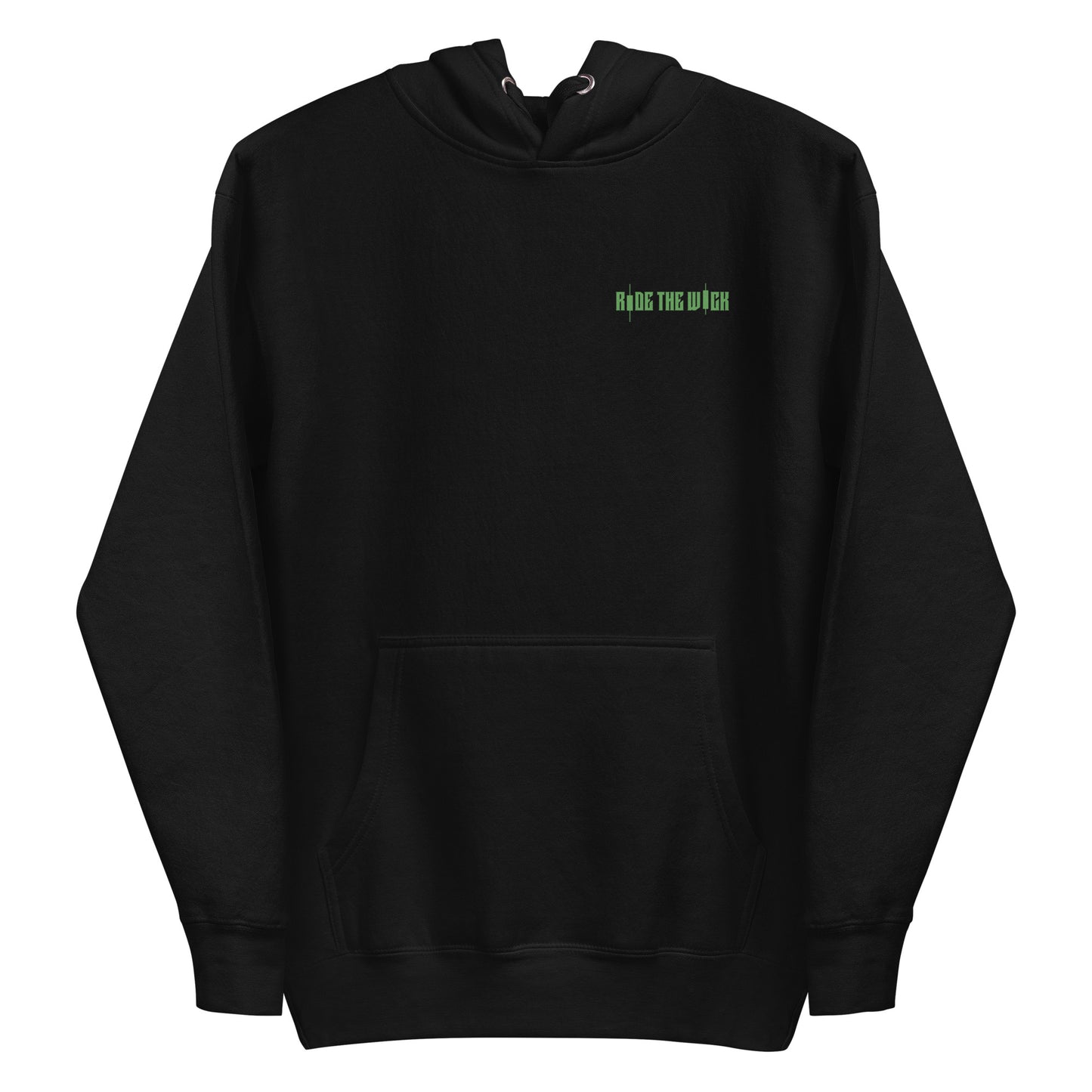 Woman wearing oversized black hoodie with small green chest text that reads “Ride the Wave,” styled with black joggers