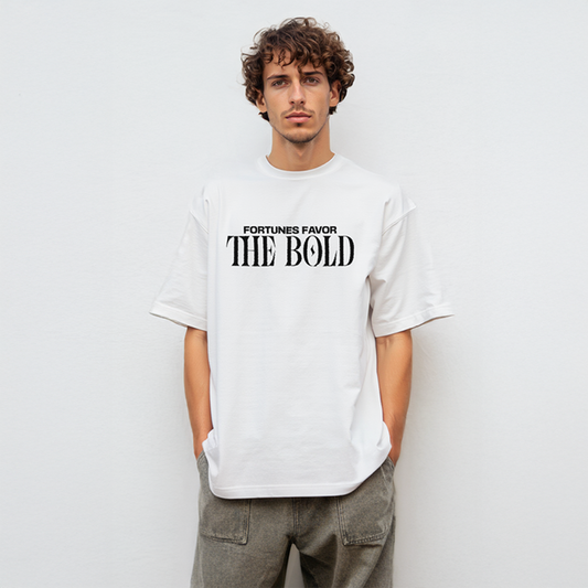 Male model wearing oversized white t-shirt with bold black text: “Fortunes Favor The Bold,” paired with gray cargo-style pants
