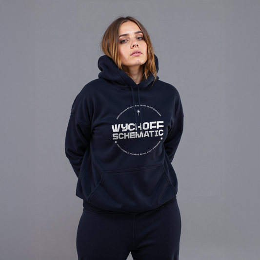 Woman wearing navy “Wyckoff Schematic” hoodie with circular crypto trading graphic, styled in matching sweatpants against gray background